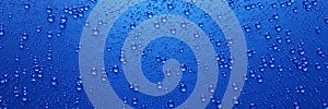 A lot of water droplets On metal or metalic surfaces in blue and dark blue shades for mobile background or wallpaper. 3D Rendering