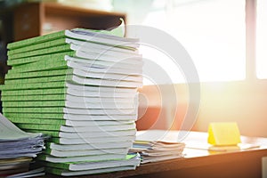 Lot of work document file working and book stacks of paper files searching information on work desk office - business report