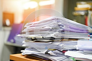 Lot of work document file working stacks of paper files searching information on work desk office - business report papers piles photo