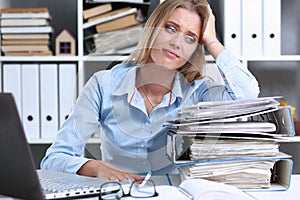 Lot of work wait for tired and exhausted woman