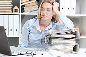 Lot of work wait for tired and exhausted woman