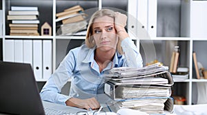 Lot of work wait for tired and exhausted woman