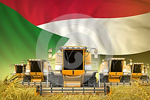 A lot of yellow farming combine harvesters on rural field with Sudan flag background - front view, stop starving concept -