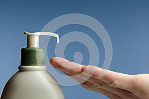 Lotion dispenser with drip and hand