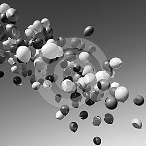 Lots of balloons flying in the sky. monochrome, black and white