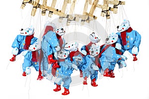 Lots of Bear puppets on strings in Christmas costumes