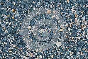 Lots of black and blue pebbles