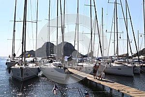 Lots of boats are moored to the pier in Ãâ¡iftlik bay.