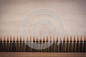 Lots of bullets on a wooden background