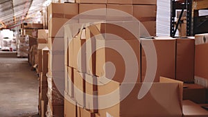 Lots of cardboard boxes in fulfillment center. Indoor view of warehouse.