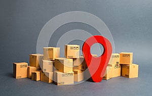 Lots of cardboard boxes and a red position pin. Locating packages and goods. Algorithm for constructing a minimum route