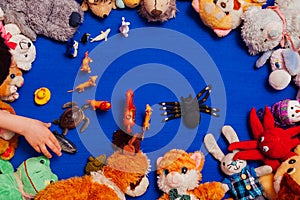 Lots of children`s toys for child development games on a blue background