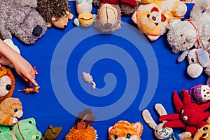 Lots of children`s toys for child development games on a blue background