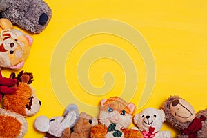 Lots of children`s toys for child development games on a yellow background