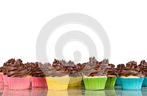 Lots of chocolate frosted cupcakes