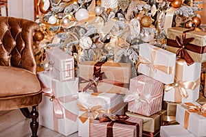Lots of Christmas gifts in boxes under the tree