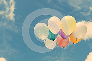 Lots of colorful balloons on the blue sky, concept of love in summer and valentine, wedding honeymoon.