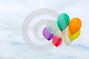 Lots of colorful balloons on the blue sky, concept of love in summer and valentine, wedding honeymoon.
