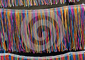 Lots of colorful braided strings on display