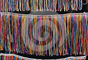 Lots of colorful braided strings on display