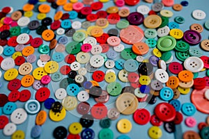 Lots of Colorful Buttons on Blue Wood