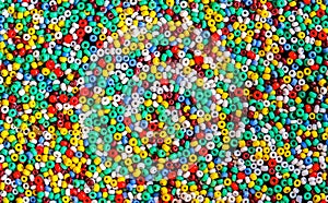 Lots of colorful fusible plastic beads used for arts and craft