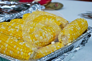 Lots of corn on the cob at a family gathering