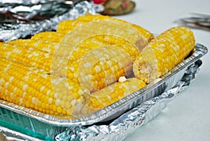 Lots of corn on the cob at a family gathering