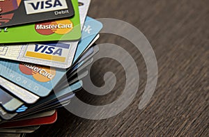 Lots of credit cards, personal debt concept. Visa and Mastercard brands