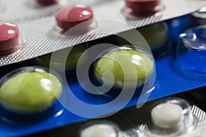 Lots of different pills on the table