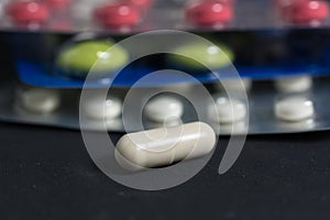 Lots of different pills on the table