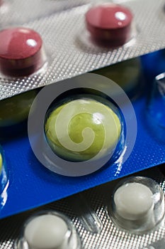 Lots of different pills on the table