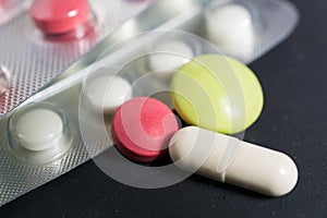 Lots of different pills on the table