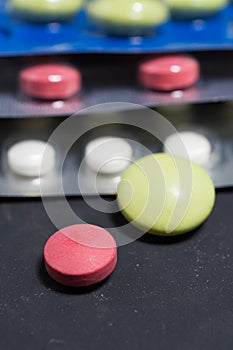 Lots of different pills on the table