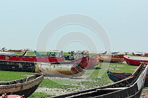 Lots of fishing boats anchored in surface of shore in Chattrogram sea beach, Bangldesh