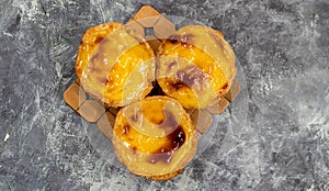 Lots of freshly baked desserts Pastel de nata or Portuguese egg tart. Pastel de Belm is a small pie with a crispy puff