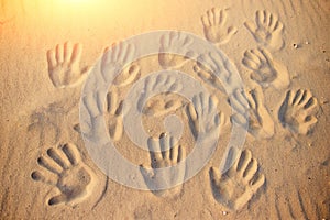 Lots of hand prints on the sand