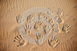 Lots of hand prints on the sand