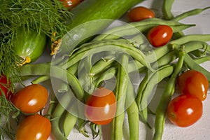 Lots of healthy vegetables and legumes for salad. Vegetarian vegetables. Dill, bean asparagus and tomatoes for lunch.