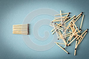 Lots of matches on a blue background. The concept of chaos and order. Selective focus