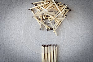 Lots of matches on a light background. The concept of chaos and order. Selective focus