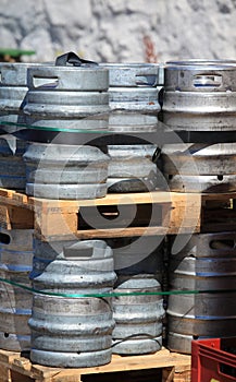 Lots of metal barrels at a beer factory