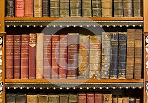 Lots of old books in a library photo