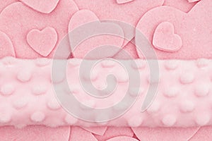 Lots of pink felt hearts with plush banner love background