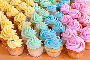 Lots of rainbow cupcakes