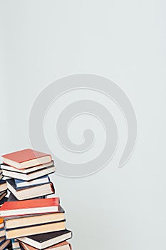 Lots of stacks of educational books to teach in the library on a white background