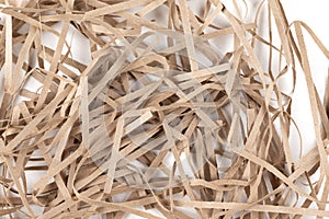 Lots of thin strips of beige paper