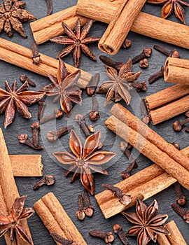 Lots of three spices for mulled wine â€“ star anise, cinnamon and clove, macro