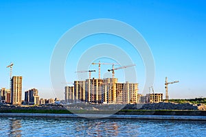 Lots of tower Construction site with cranes and building with blue sky background