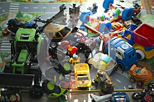 Lots of toys on a carpet in a kid room